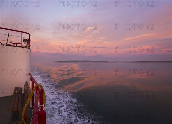 View from ferry towards sea at sunrise