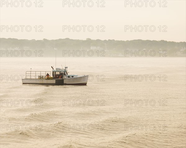 Lobstermen fishing at sunrise