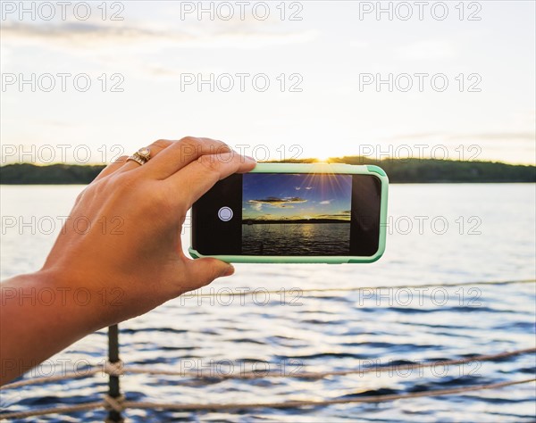 Woman taking picture with smartphone