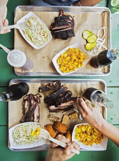 Friends eating barbecue food