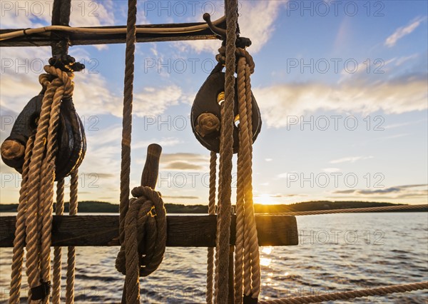 Close-up od rope ladder against sunset sky