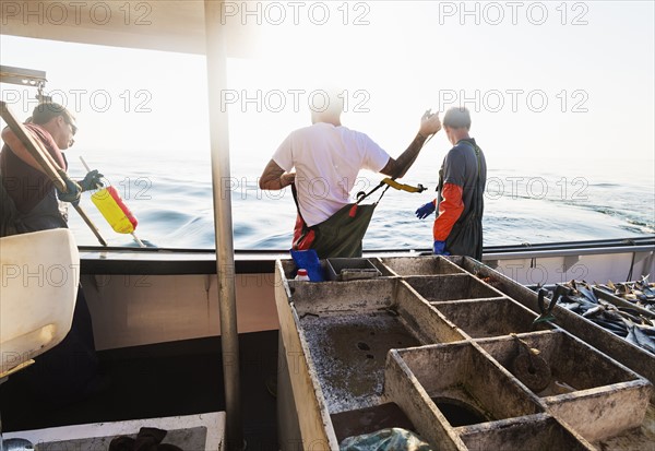Fishermen working on boat