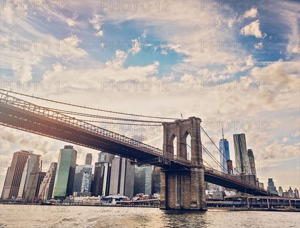 Brooklyn Bridge over Hudson River with Financial district in background