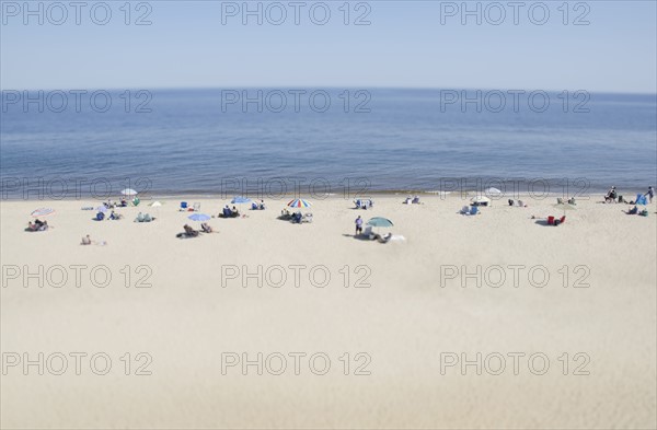 People relaxing on beach