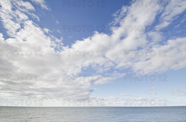 Seascape and cloudy sky