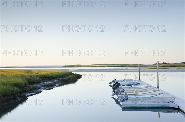 Boats moored in dock