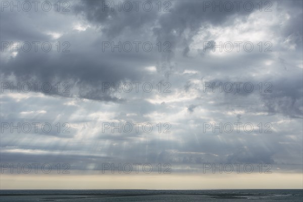 Scenic cloudscape with sunbeams