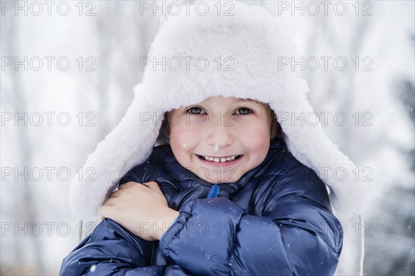 Portrait of boy (6-7) in fur hat