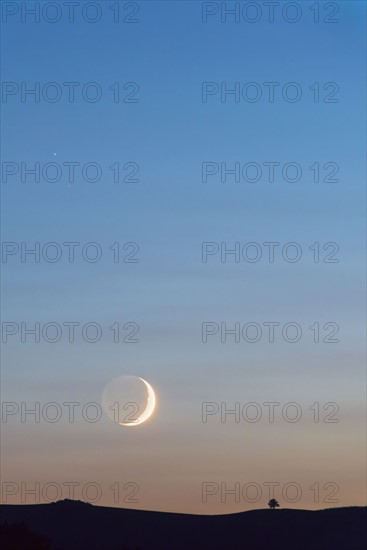 Moon on sky at sunset