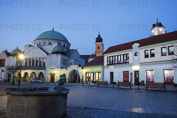 Buildings at town square at dusk