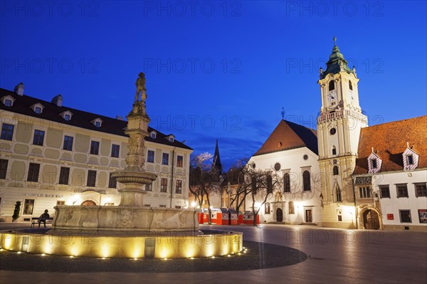 Illuminated town square at dusk