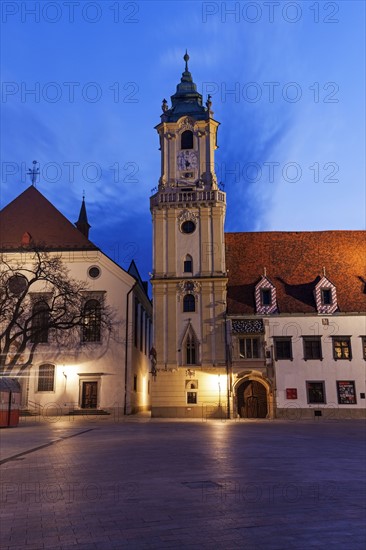 Illuminated town hall at dusk