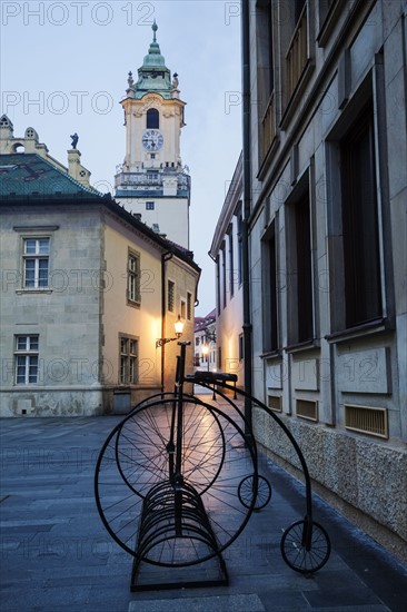 Stationary bicycles with architecture in background