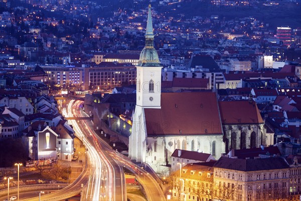 City street and St. Martin's Cathedral at night