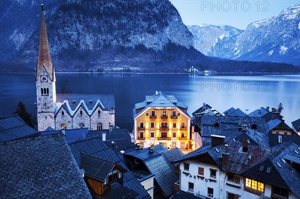 Town with lake and mountains in background