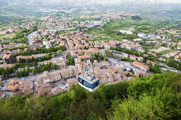 Overhead cable car with townscape in background