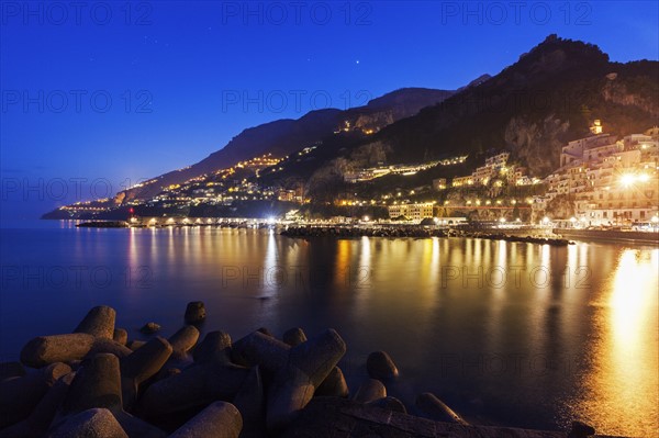 Illuminated town on coastline