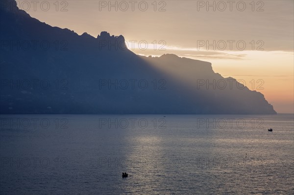 Silhouette of coastline at sunrise