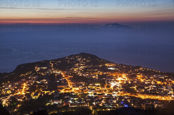 Illuminated cityscape at dusk