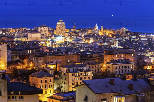 Cityscape with harbor in background at dusk