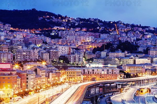 Highway along illuminated city