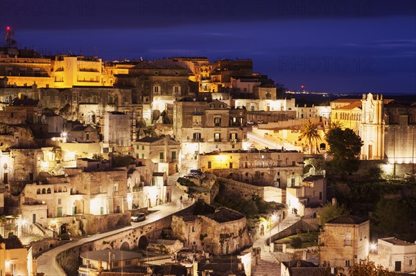 Illuminated city buildings at dusk