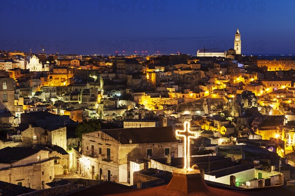 Illuminated city buildings at night