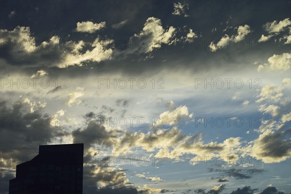 Office building against dramatic sky