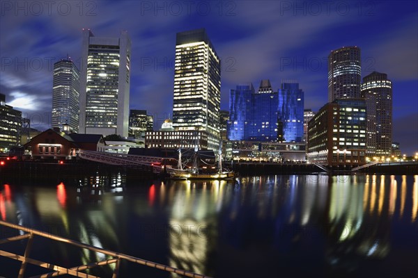 Waterfront reflected in Fort Point Channel at dawn