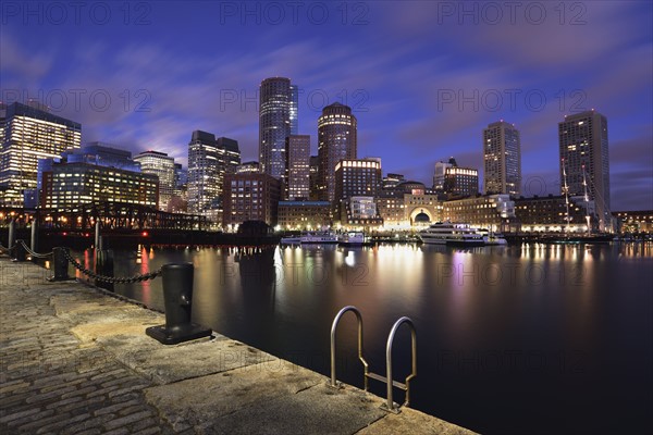 Waterfront reflected in Fort Point Channel at dawn