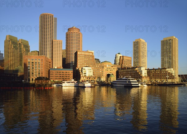 City waterfront reflected in harbor