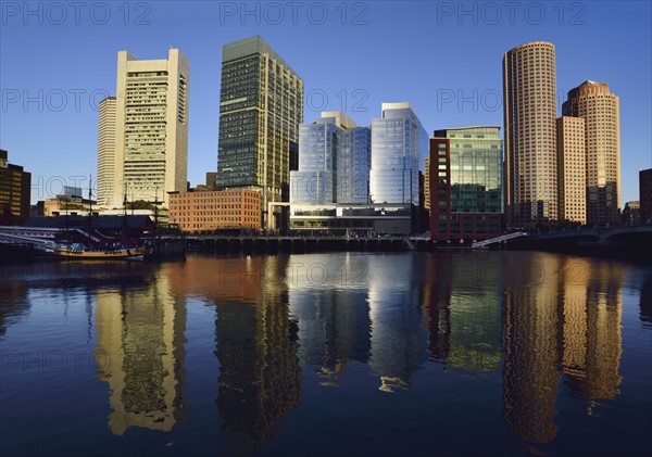 City waterfront reflected in Fort Point Channel