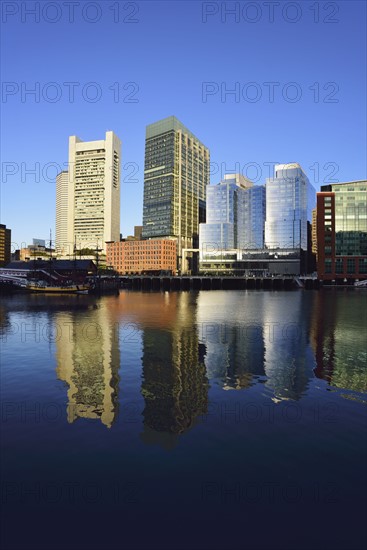 City waterfront reflected in Fort Point Channel