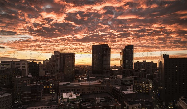 Dramatic sky over city at sunset