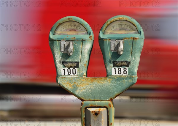 Old parking meter against panning transportation mode