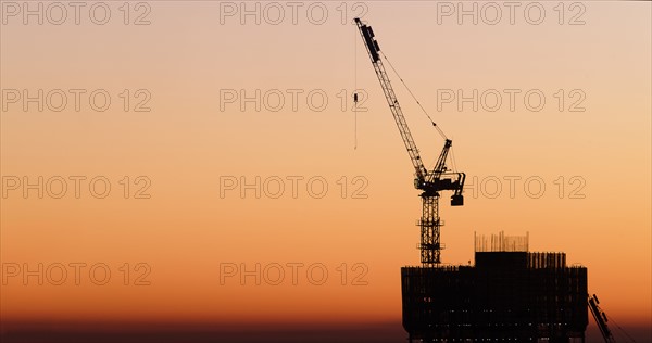 Silhouette of skyscraper under construction. New York City, New York, USA.