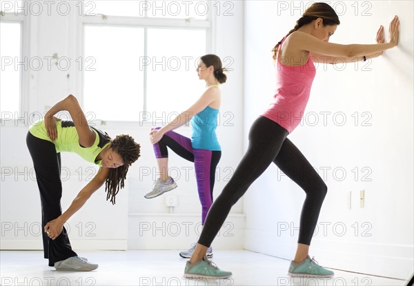 Women exercising at gym.