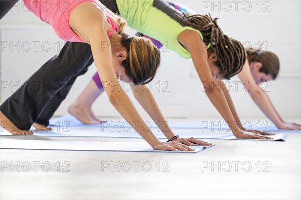 Women practicing yoga.