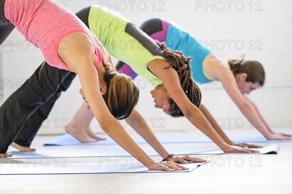 Women practicing yoga.