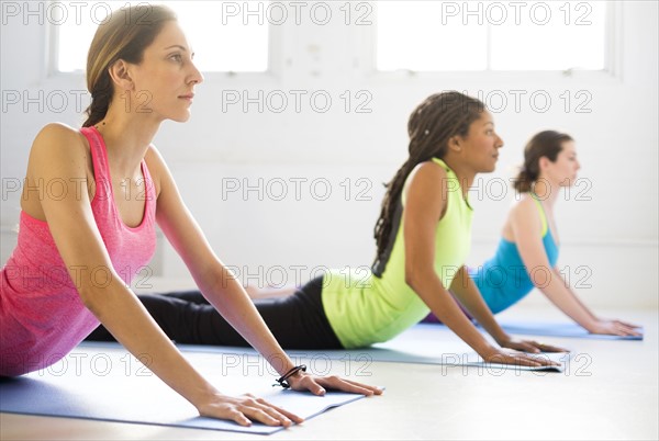 Women practicing yoga.