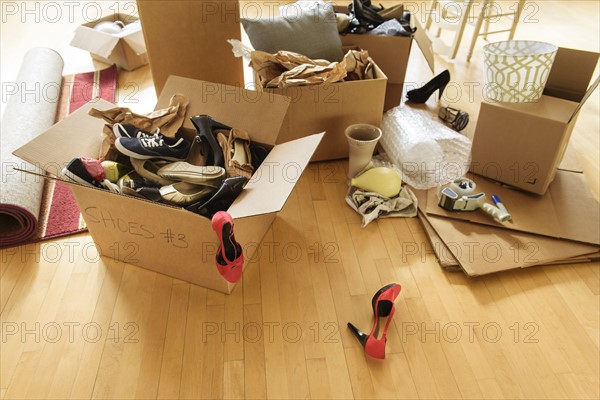 Cardboard boxes on wooden floor.