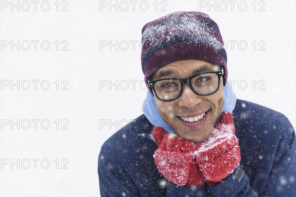 Portrait of mid adult man standing on snow.