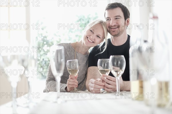 Couple sitting at table.