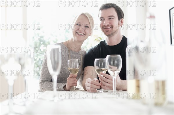 Couple sitting at table.