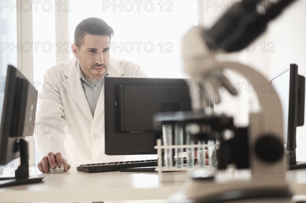 Man using computer in laboratory.