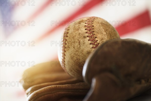 Close-up of baseball glove and ball.