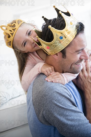 Daughter (6-7) hugging father