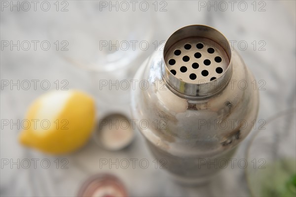 Cocktail in cocktail shaker on table