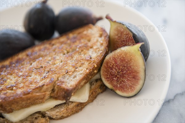 Grilled cheese sandwich with figs on plate
