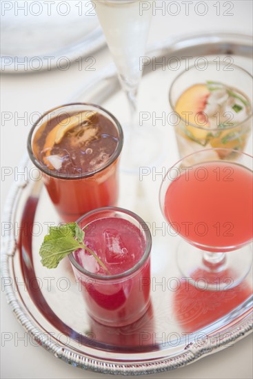 Cocktails in glasses on tray